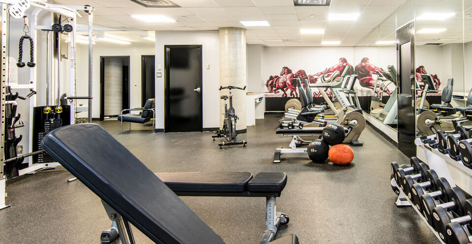 Image of a man running on a treadmill at our Montreal Hotel Fitness Center